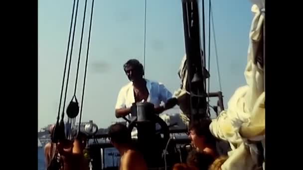 Riccione Italy August 1980 Man Sailboat Turning Rudder — Vídeos de Stock