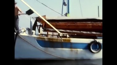 rimini, italy august 18 1970:boat with fishermen at sea 70s