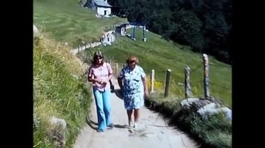 milan,italy june 10 1970:people on vacation mountain