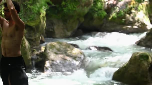 Guy Does Yoga Banks River Shirtless — Stockvideo