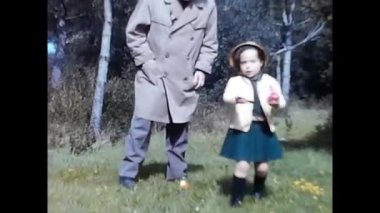rome ,italy june 01 1960:family has fun in the countryside with their 60s children