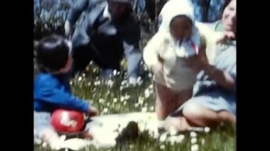 rome ,italy june 01 1960:family has fun in the countryside with their 60s children