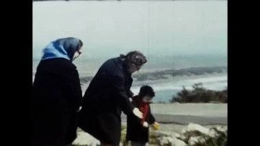 argentario, italy march 1960 : family with car on holiday on the Argentario cliff in the 60s