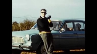 argentario, italy march 1960 : family with car on holiday on the Argentario cliff in the 60s