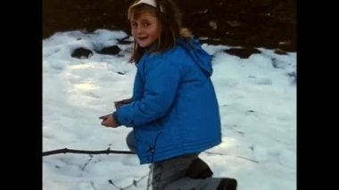 campotosto, Abruzzo May 1960 : people with children in the mountains with snow carried out activities in the 60s