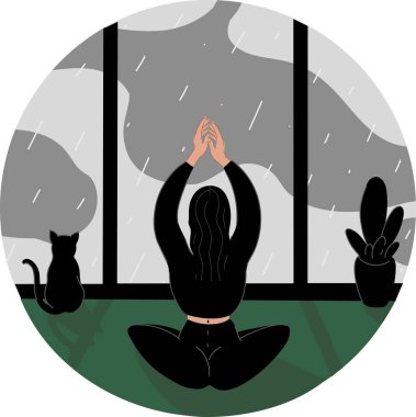 Yağmurlu bir günde kedi ve pencerenin yanında yoga yapan bir kadının resmi