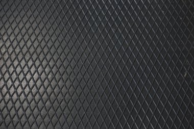 Siyah metal desenli çelik arka plan. Delinmiş metal levha.