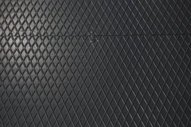 Siyah metal desenli çelik arka plan. Delinmiş metal levha.