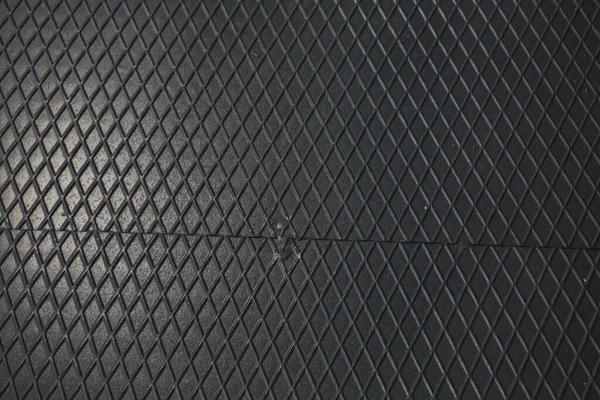 Siyah metal desenli çelik arka plan. Delinmiş metal levha.