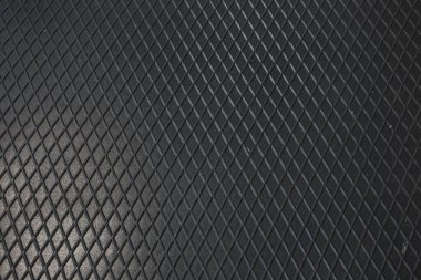 Siyah metal desenli çelik arka plan. Delinmiş metal levha.