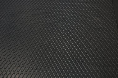 Siyah metal desenli çelik arka plan. Delinmiş metal levha.