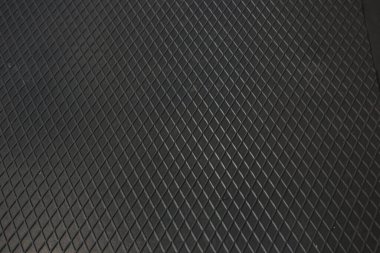 Siyah metal desenli çelik arka plan. Delinmiş metal levha.