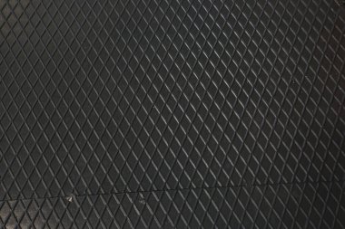 Siyah metal desenli çelik arka plan. Delinmiş metal levha.