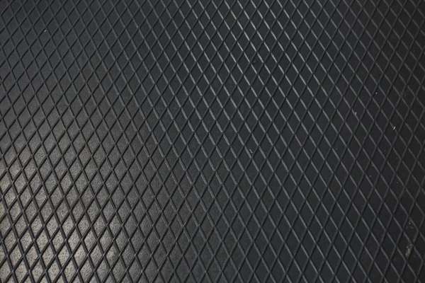 Siyah metal desenli çelik arka plan. Delinmiş metal levha.