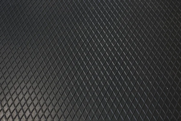 Siyah metal desenli çelik arka plan. Delinmiş metal levha.