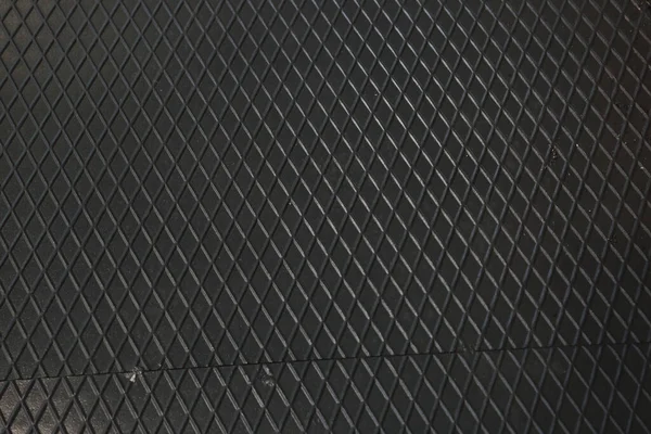Siyah metal desenli çelik arka plan. Delinmiş metal levha.