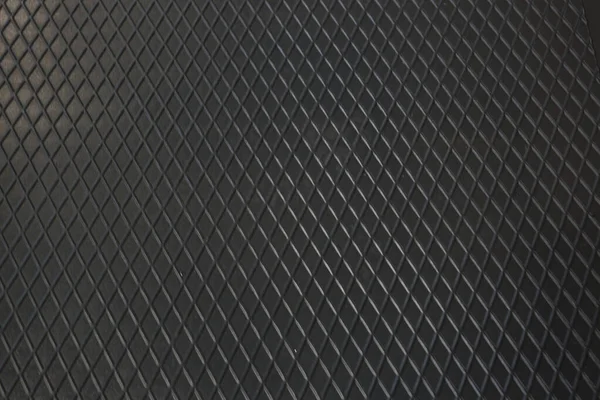 Siyah metal desenli çelik arka plan. Delinmiş metal levha.