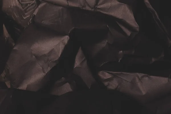 黒のしわの多い紙の背景グランジの質感の背景 — ストック写真