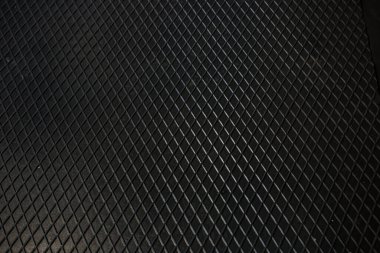 Siyah metal desenli çelik arka plan. Delinmiş metal levha.