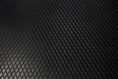 Siyah metal desenli çelik arka plan. Delinmiş metal levha.