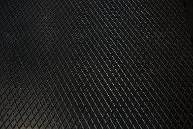 Siyah metal desenli çelik arka plan. Delinmiş metal levha.