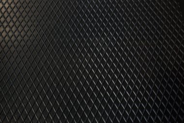 Siyah metal desenli çelik arka plan. Delinmiş metal levha.