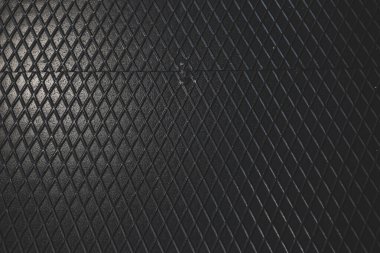 Siyah metal desenli çelik arka plan. Delinmiş metal levha.