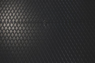 Siyah metal desenli çelik arka plan. Delinmiş metal levha.