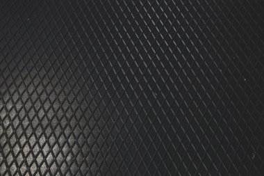 Siyah metal desenli çelik arka plan. Delinmiş metal levha.