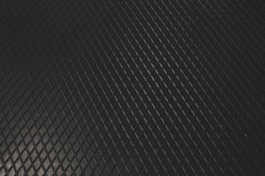 Siyah metal desenli çelik arka plan. Delinmiş metal levha.