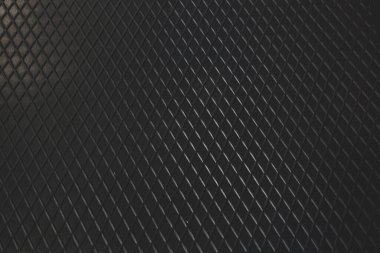 Siyah metal desenli çelik arka plan. Delinmiş metal levha.