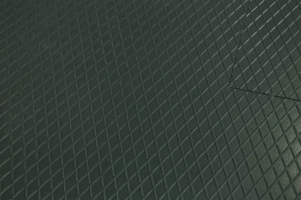 Siyah metal desenli çelik arka plan. Delinmiş metal levha.