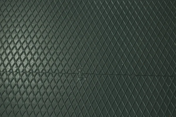 Siyah metal desenli çelik arka plan. Delinmiş metal levha.