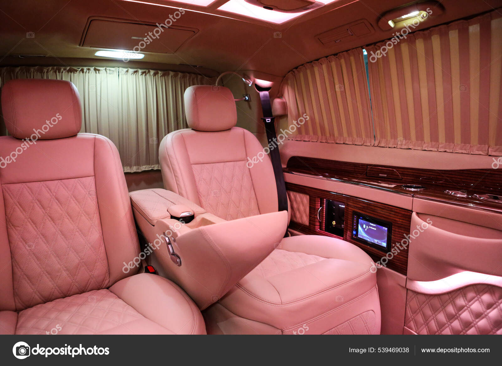 Luxury Modern Pink Car Interior — Stock Photo © utkudemirsoy #539469038 This luxurious modern pink car interior exudes elegance and sophistication with its sleek design and plush pink leather seats. The soft lighting and high-tech features make this car a truly stylish and comfortable ride for anyone looking to make a statement on the road.