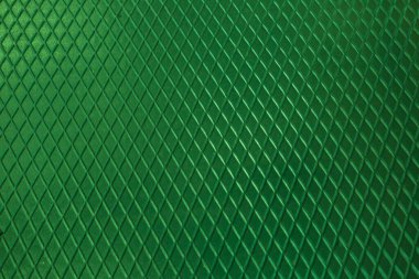 Yeşil metal desenli çelik arka plan. Delinmiş metal levha.