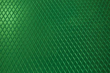 Yeşil metal desenli çelik arka plan. Delinmiş metal levha.