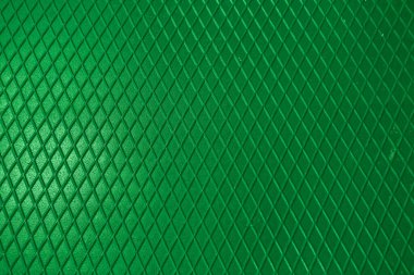 Yeşil metal desenli çelik arka plan. Delinmiş metal levha.
