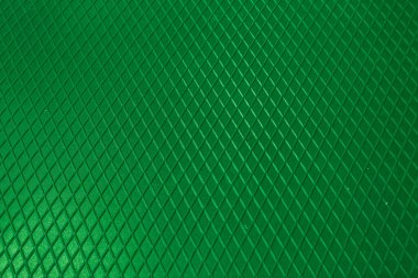 Yeşil metal desenli çelik arka plan. Delinmiş metal levha.