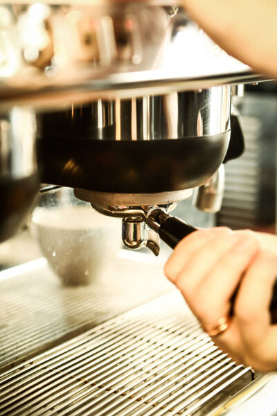 Barista brewing coffee in the coffee room