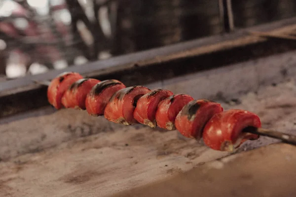 Roasted tomatoes on the barbecue at the kitchen