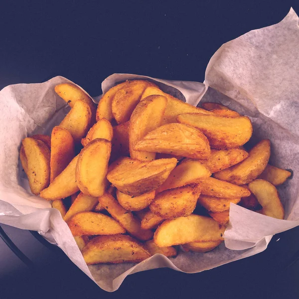 stock image Delicious snack plate, french fries, onion rings, spring rolls or sausages on the table 