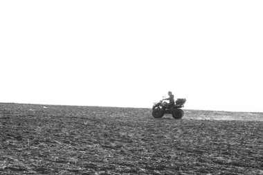 helmet sitting on atv quad bike in mountains