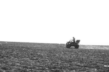 helmet sitting on atv quad bike in mountains