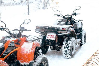 helmet sitting on atv quad bike in mountains
