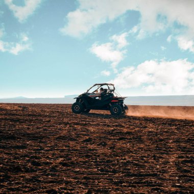 helmet sitting on atv quad bike in mountains