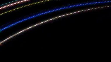 Siyah arkaplandaki renkli çizgilerle ince hareketleri düzenleyen, parıldayan, parlak güzel videolar.