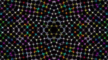 Parlayan güzel soyut bir kaleydoskop, ince hareketleri düzenleyen parlak bir ışık.
