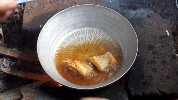 Cooking Salted Fish Using Traditional Wood Fired Stove — Stock Video