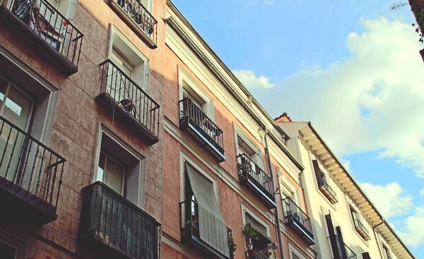 Facade of a building in Corredera Alta de San Pablo street in Madrid, Spain. Traditional architecture of the houses in the center of the Spanish capital.