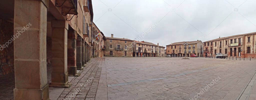 Main Square (plaza mayor) of the medieval town of Medinaceli in Soria, Spain. Historic town with a large number of monumental (old town) buildings that is now commonly visited by tourists.